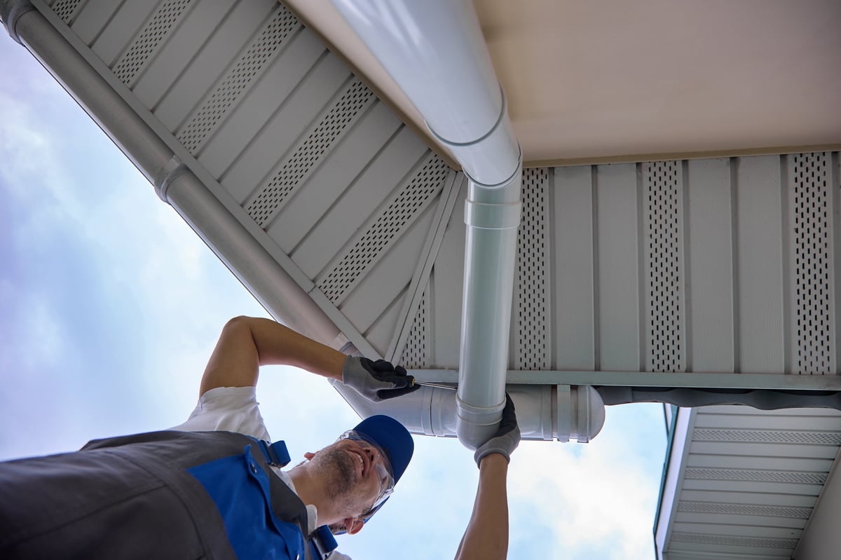 View below installation modern rainwater drainage system from roof