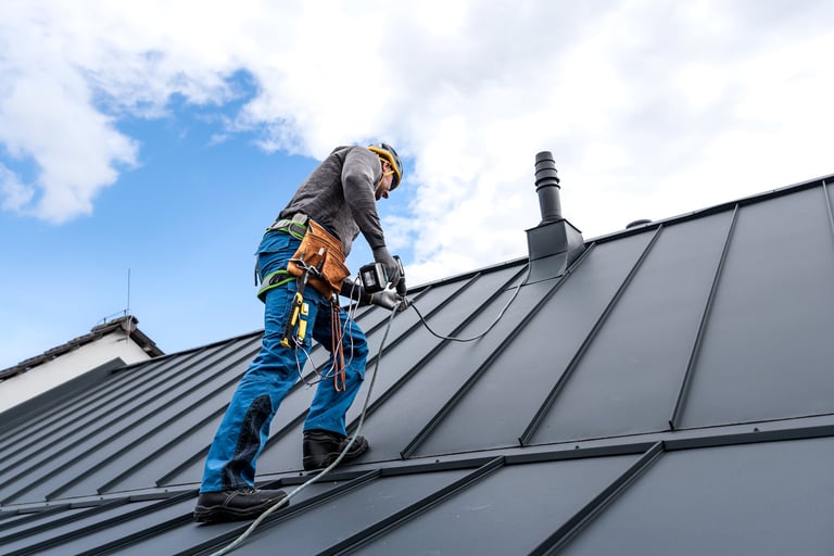 Roofer climbing to top of roof