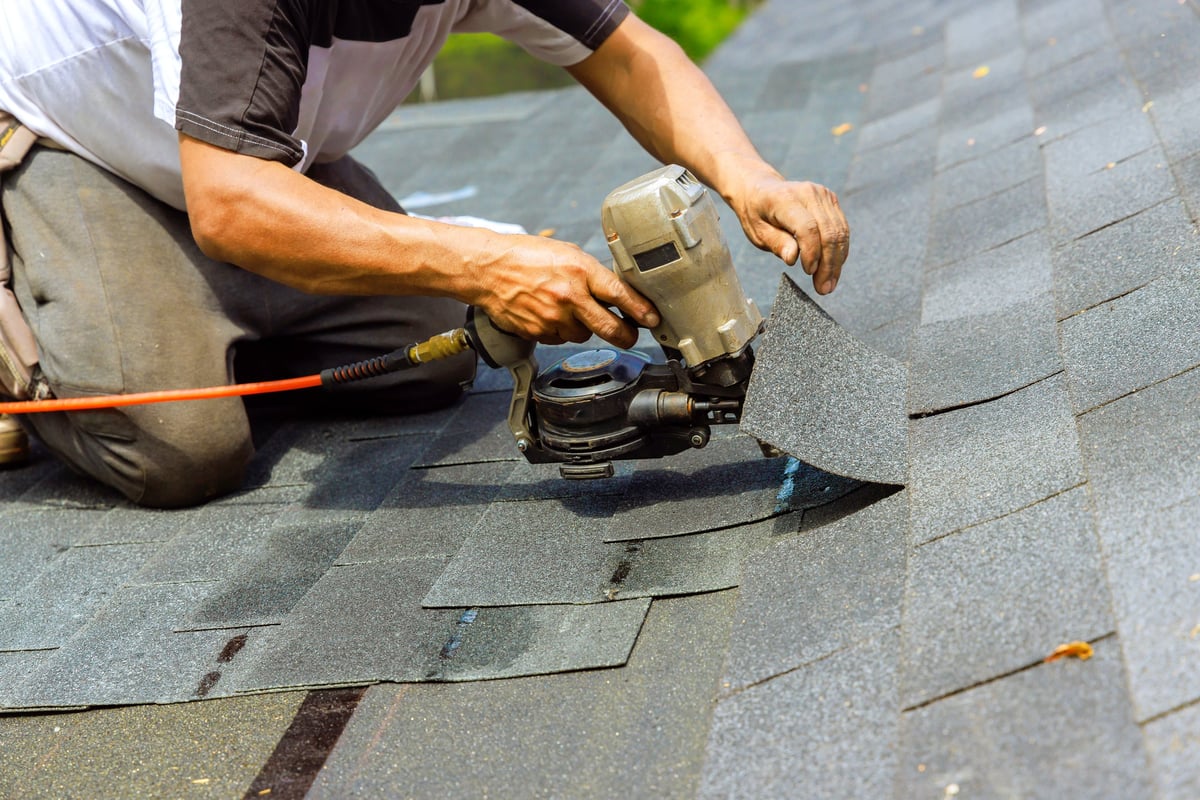 During installation of new bitumen shingles with pneumatic air nail gun