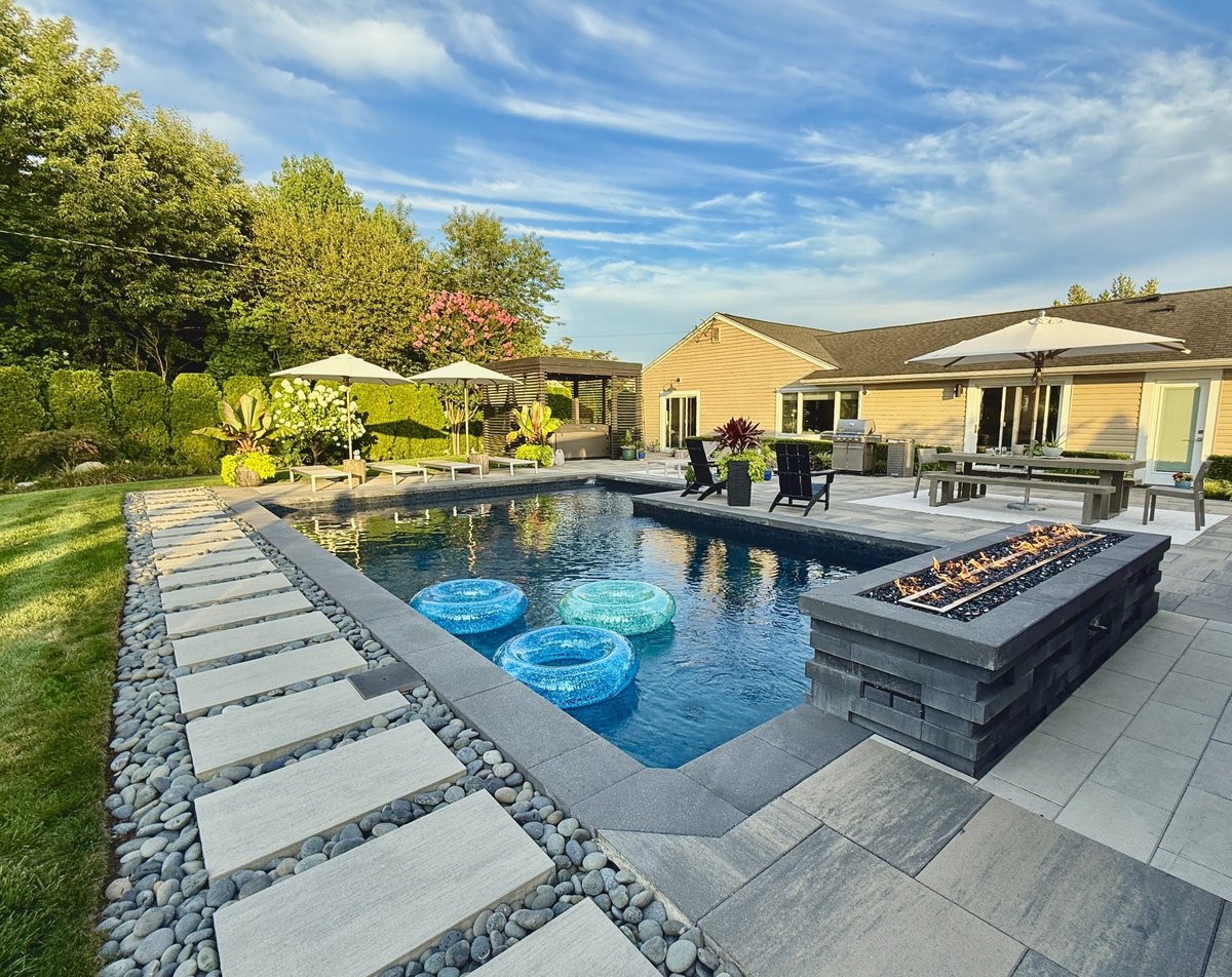 Luxurious outdoor seating area with chair sofa bar and table