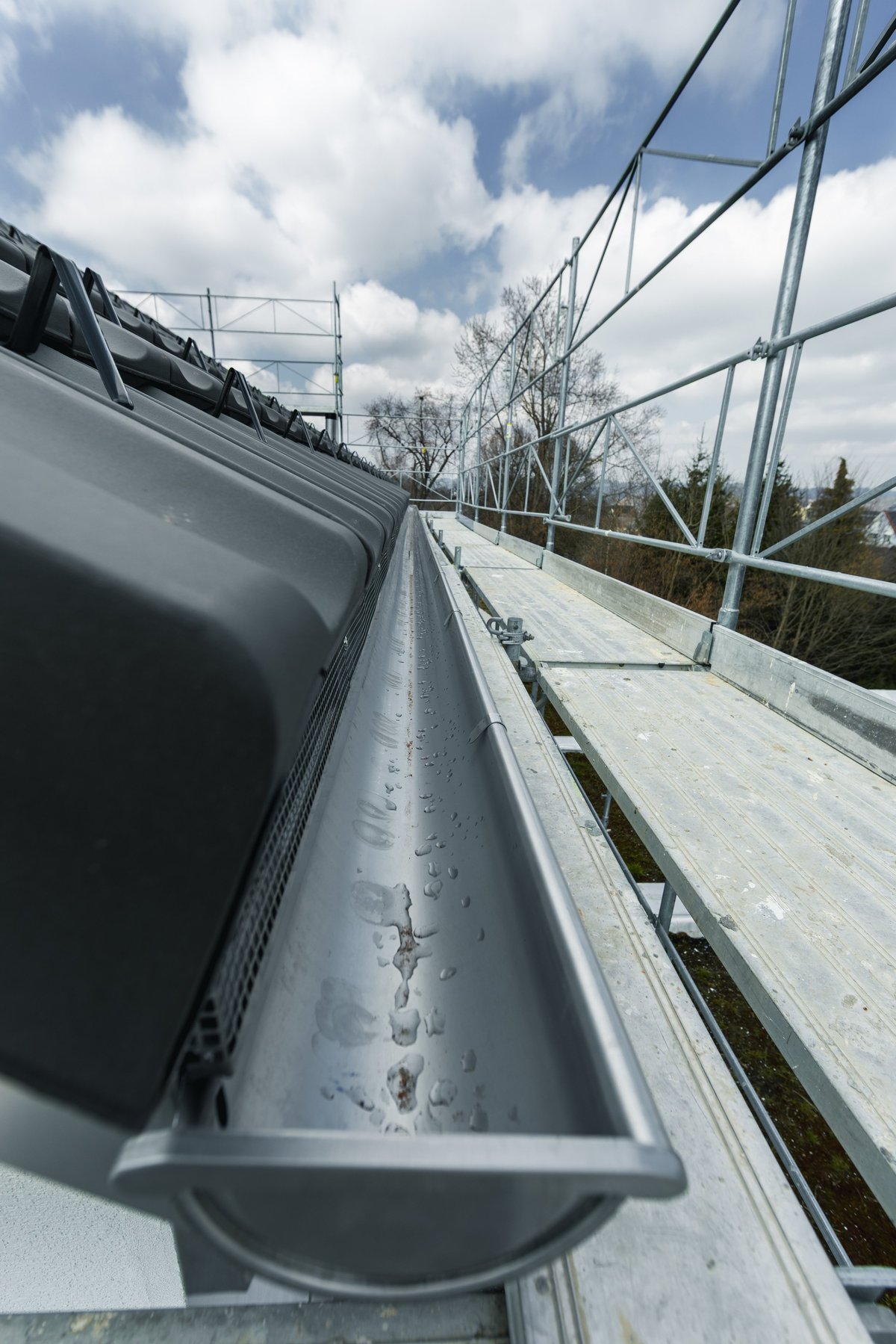 Close-up view of new roof gutter installation